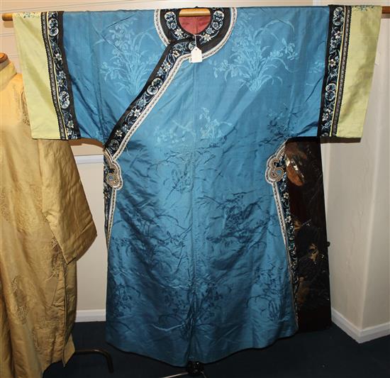 A Chinese blue silk, damask and embroidered ladys robe, late 19th / early 20th century,